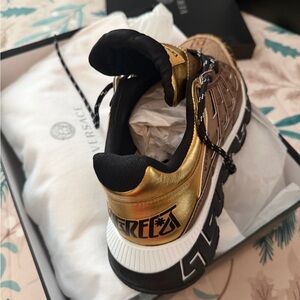 Versace Women's Sneakers in Gold and Black